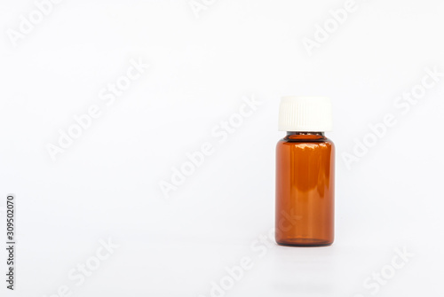blank packaging prescription  brown glass supplement medicine white pills isolated on white background 