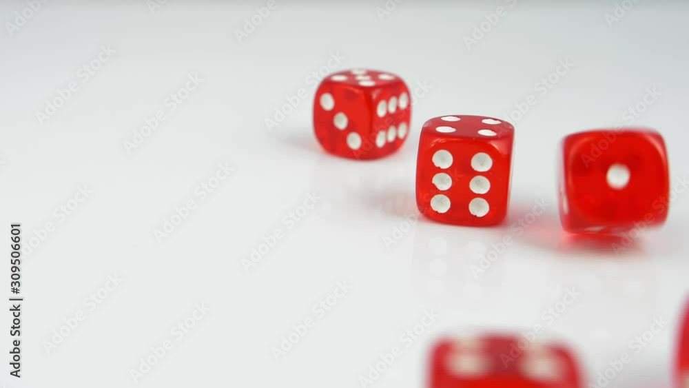 Rolling Red Casino Dice on White Table Slow Motion Rolling Red Casino Dice on White Table Slow Motion