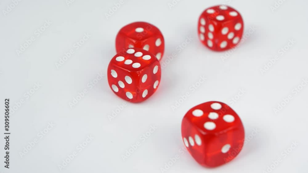 Rolling Red Casino Dice on White Table Slow Motion Rolling Red Casino Dice on White Table Slow Motion