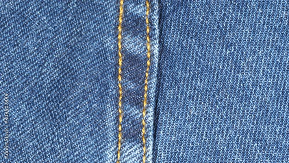 Sliding over seam on blue denim jeans. Denim textile close up, macro. Dolly shot Sliding over seam on blue denim jeans. Denim textile close up, macro. Dolly shot
