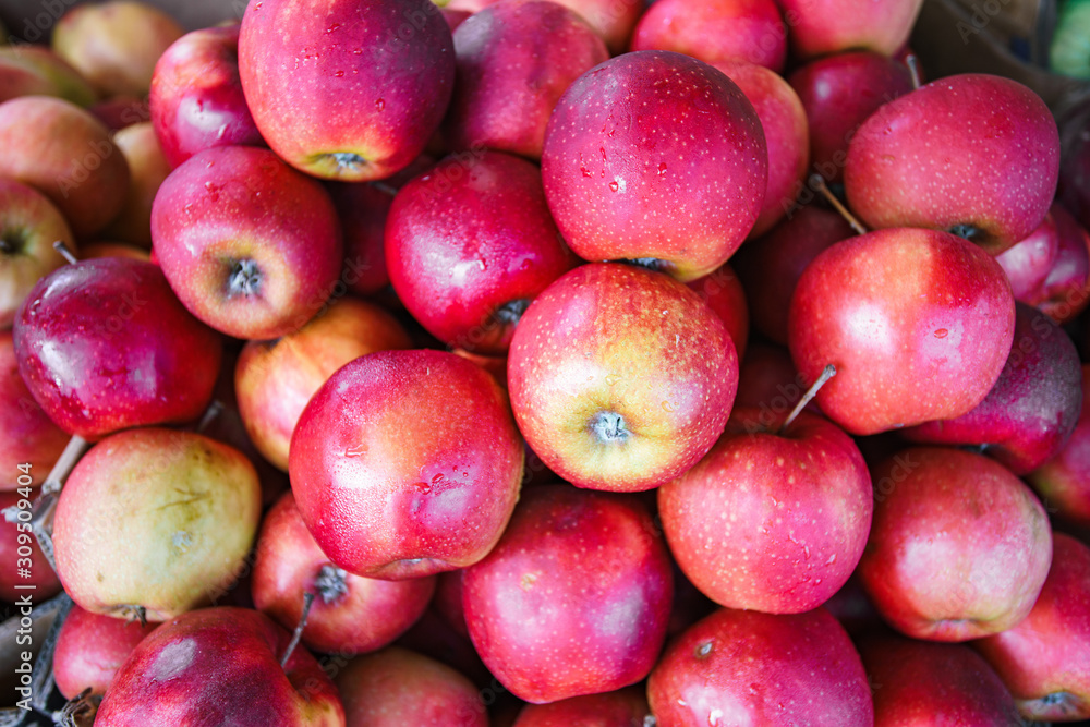 Red apples background, freshly picked tasty fruits Red apples background, freshly picked tasty fruits