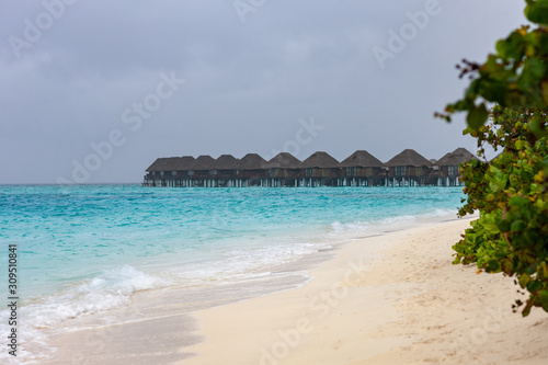 Tropical paradise beach on a rainy day. Tropical summer beach holiday vacation travel lifestyle lifestyle, resort hotel business concept