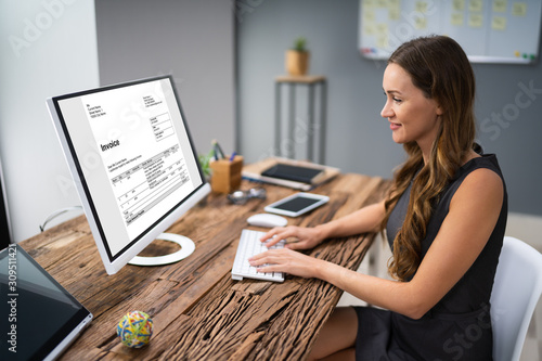Young Businesswoman Using On Computer At Desk