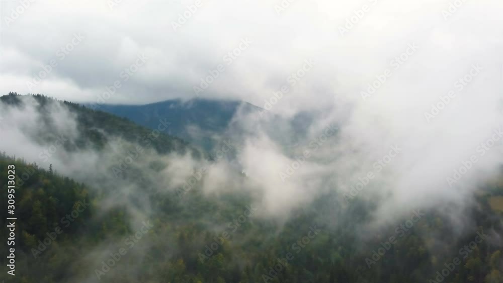 4K .Aerial landscape. Fly in mountain clouds, gloomy day 4K .Aerial landscape. Fly in mountain clouds, gloomy day