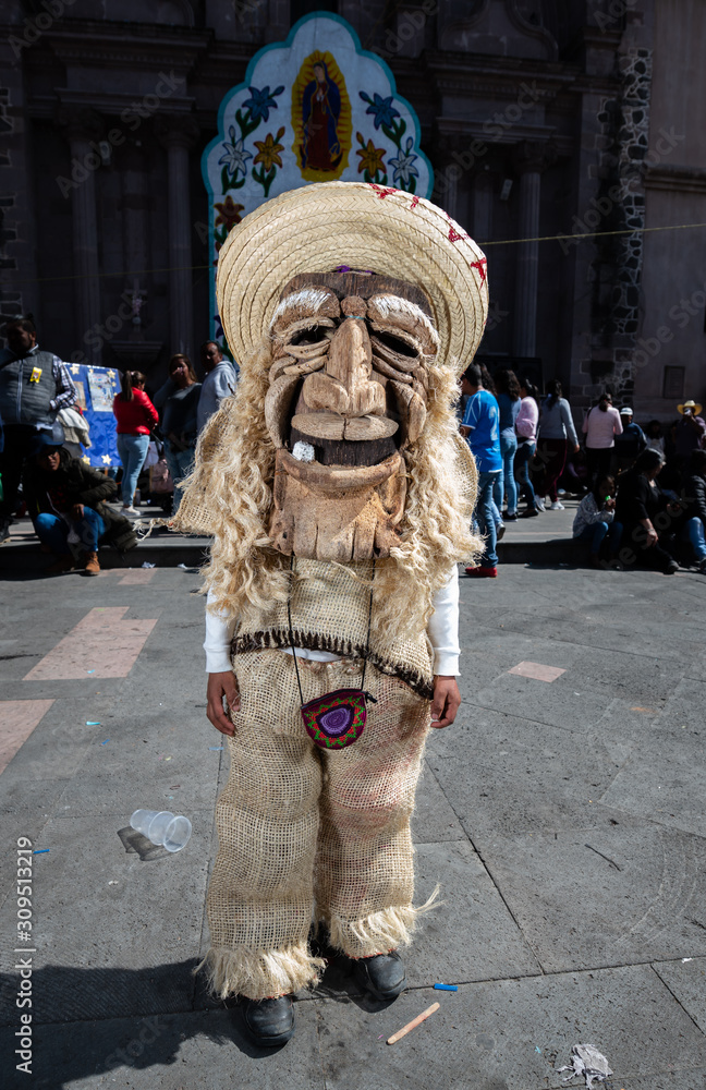 Traditional Mexican dancer known as Chinelo, outside a church, these types  of masks are used in the center of Mexico in the Temacalcingo region Stock  Photo | Adobe Stock