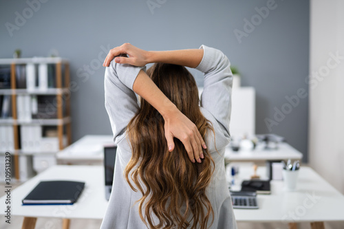 Businesswoman Stretching Her Arms photo
