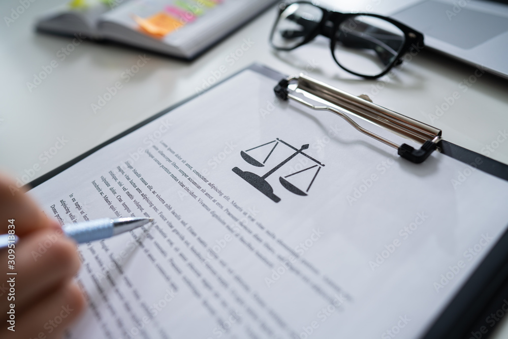 Person Reading Legal Document Person Reading Legal Document