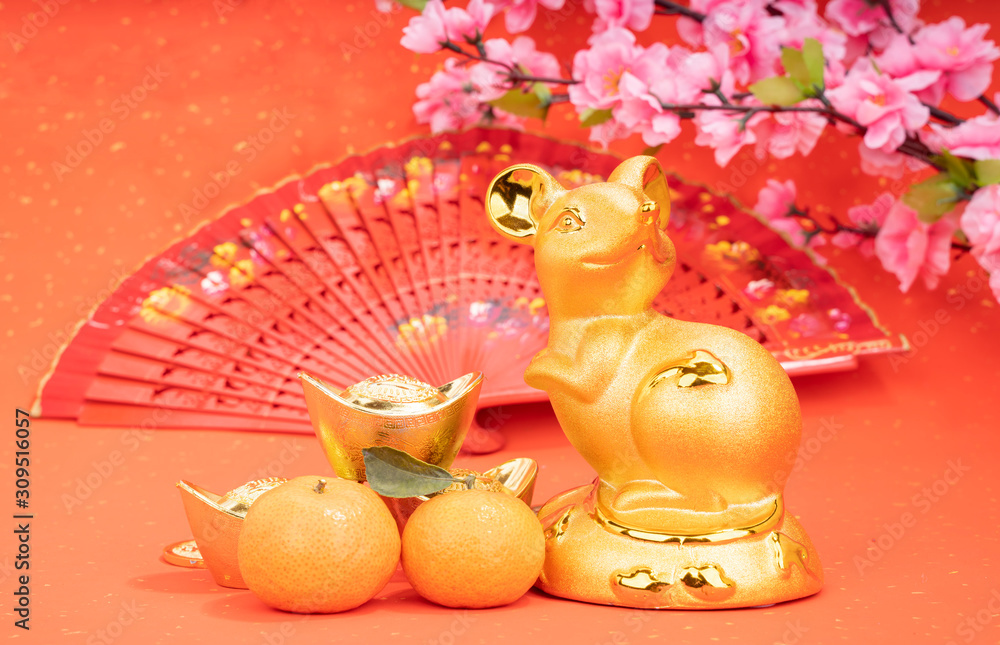Fototapeta premium Tradition Chinese golden rat statue rat,2020 is year of the rat,Chinese characters on gold ingot translation: good bless for money.