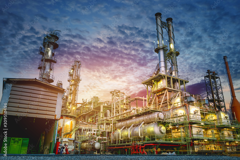 Industrial furnace and heat exchanger cracking hydrocarbons in petroleum factory on sky sunset background, Manufacturing of petrochemical plant