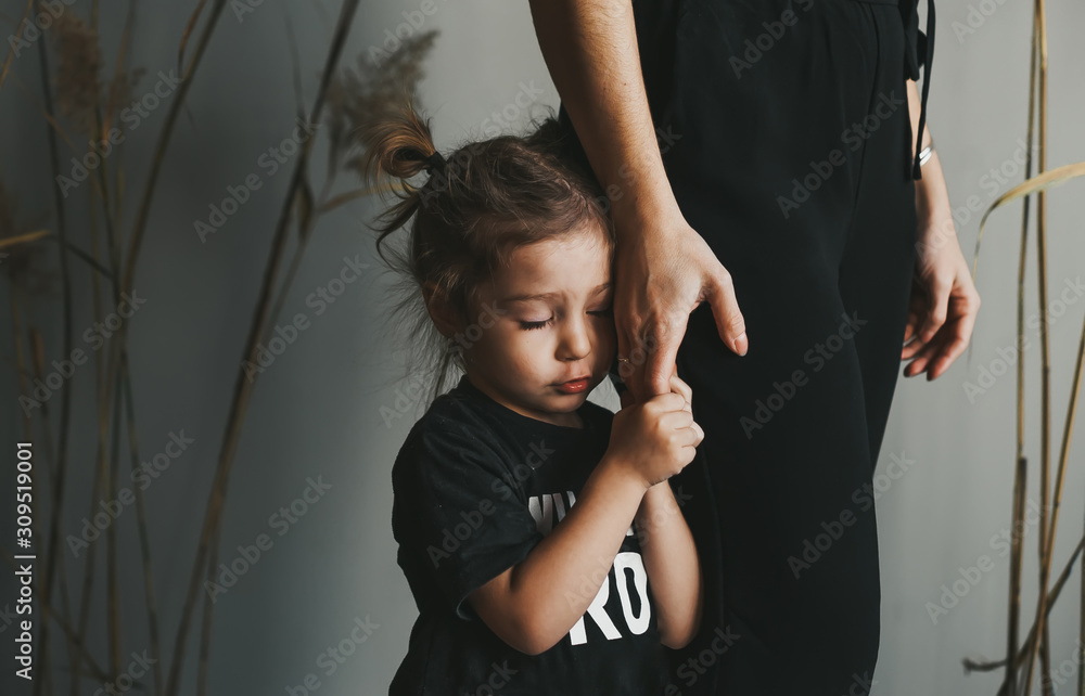 Depression daughter hugging her hand of mother with sad face.