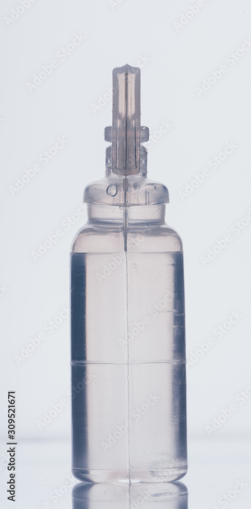 Glass medical ampoule vial for injection. Medicine is dry white drug penicillin powder or liquid with of aqueous solution in ampulla. Close up. Bottles ampule with aluminum cap on backgrounds gray. Glass medical ampoule vial for injection. Medicine is dry white drug penicillin powder or liquid with of aqueous solution in ampulla. Close up. Bottles ampule with aluminum cap on backgrounds gray.