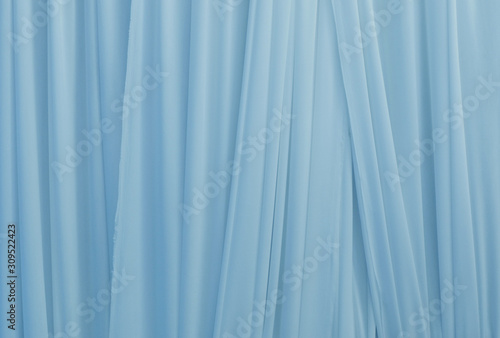 beautiful light blue smooth cloth background vertical line, pastel fabric layer background, nice volume texture of textile, background of modern pattern, cloth wall with space use for element