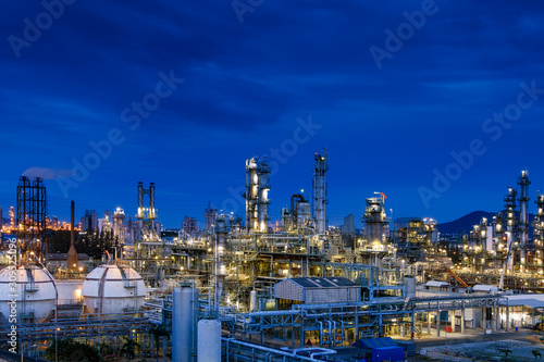 Petrochemical plant with sky twilight background, Oil and gas refinery industrial at night time, Factory with dawn sky