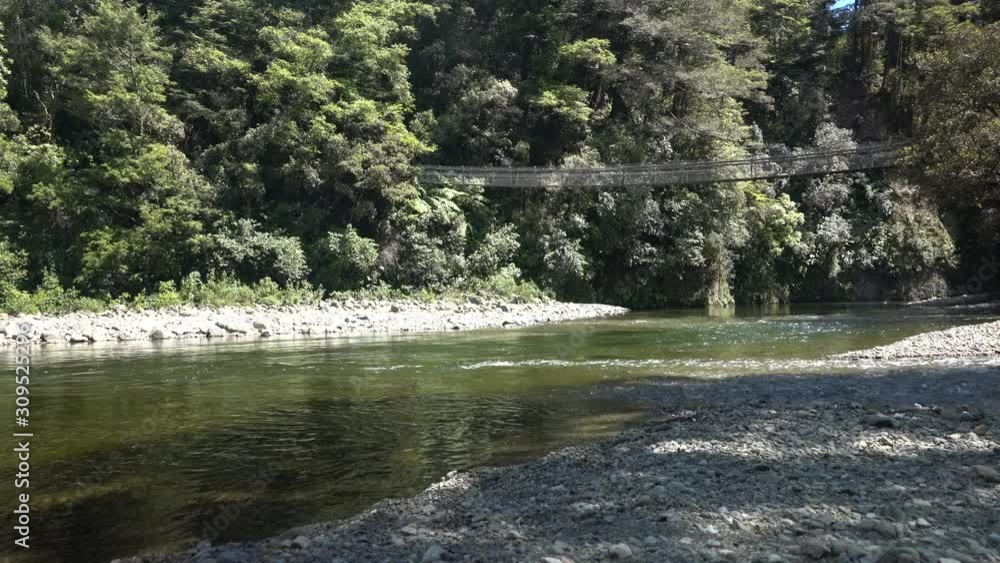 Swing Bridge on a walking trail at Kaitoke in New Zealand Swing Bridge on a walking trail at Kaitoke in New Zealand