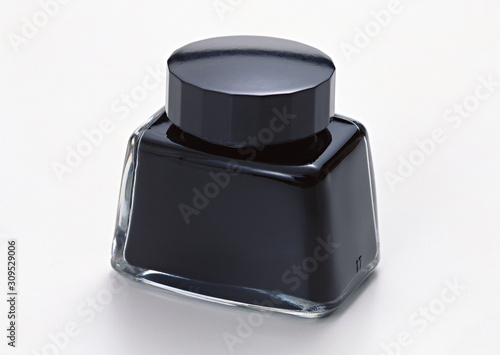 Ink bottle on white background