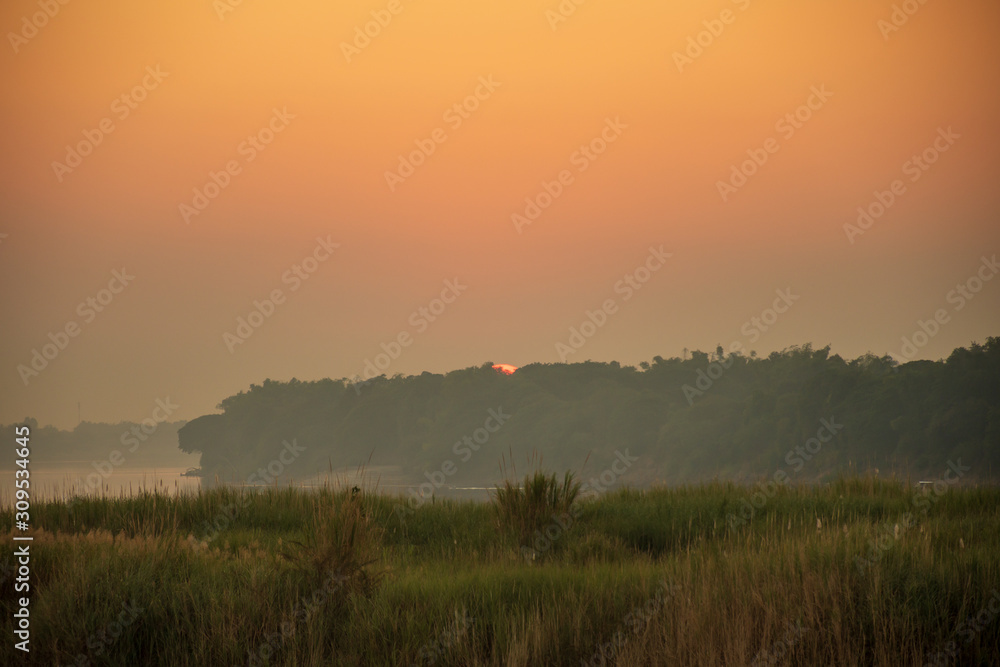 Scenic View Of Field Against Sky During Sunset
