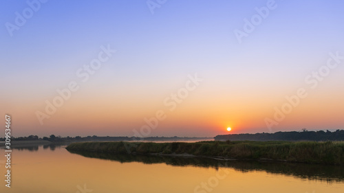 Scenic View Of River Against Sky During Sunset