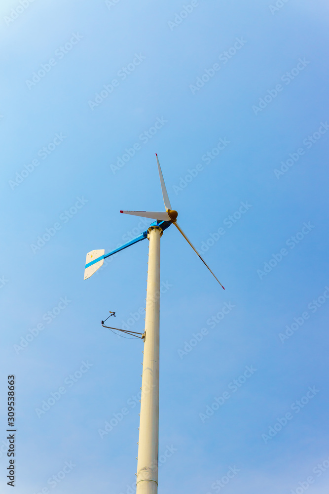 Low Angle View Of Wind Turbine Against Clear Sky Low Angle View Of Wind Turbine Against Clear Sky
