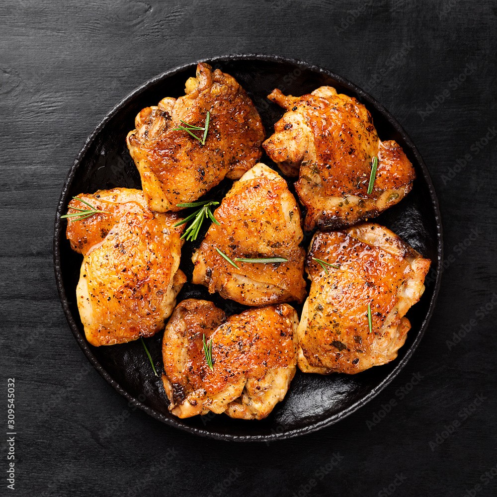 Grilled chicken thighs with spices and lemon. Top view - obrazy, fototapety, plakaty 