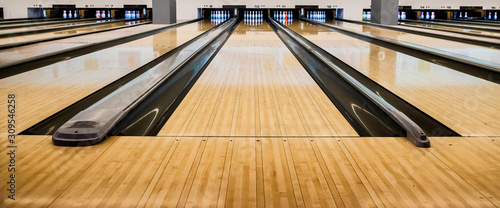 Fotografie Close up of bowling balls, bowling pins bowling balls in a row.