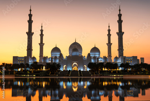 Sheikh Zayed Grand Mosque reflected on the water in Abu Dhabi emirate of UAE