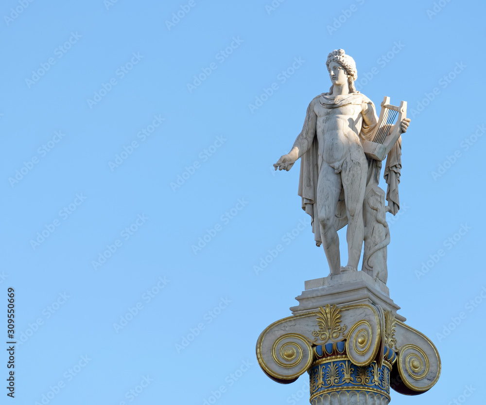 Apollo statue with his face illuminated by sun rays on blue sky background, space for text