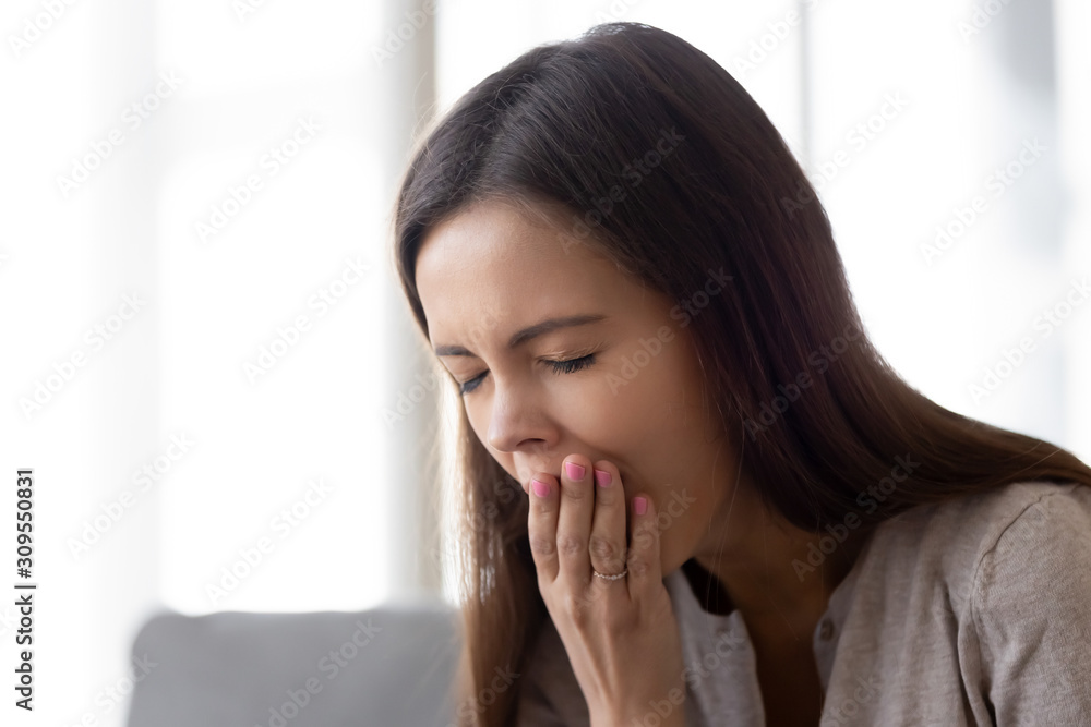 Close up of young woman yawn lacking sleep Close up of young woman yawn lacking sleep