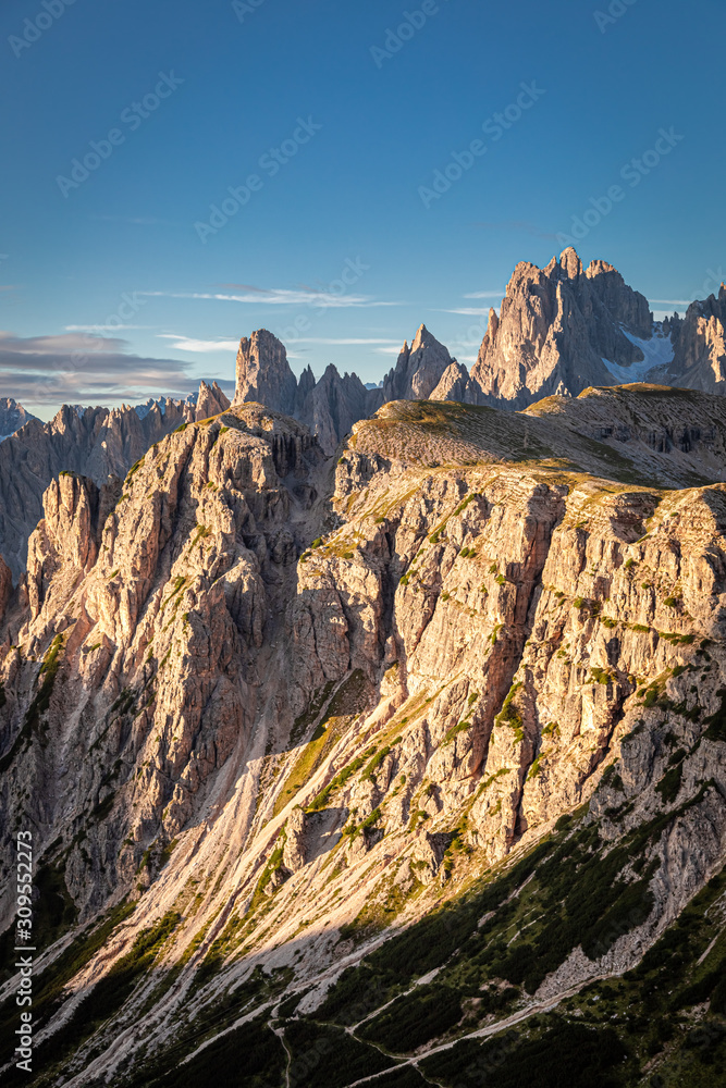 Sunrise at Dolomites by the mountain trail to Tre Cime