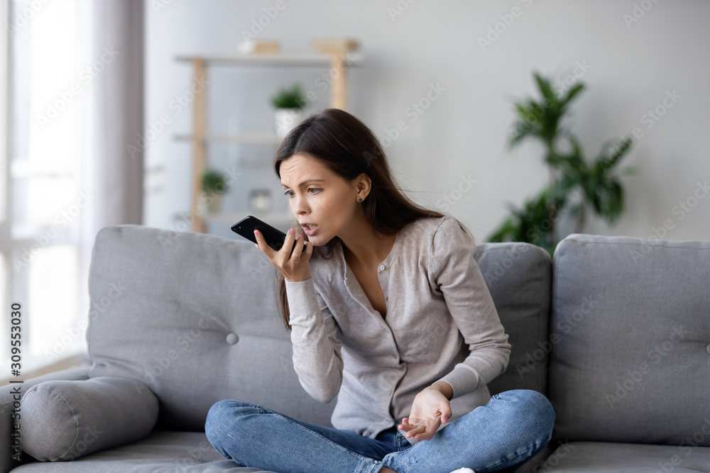 Mad girl argue talking on smartphone at home Mad girl argue talking on smartphone at home