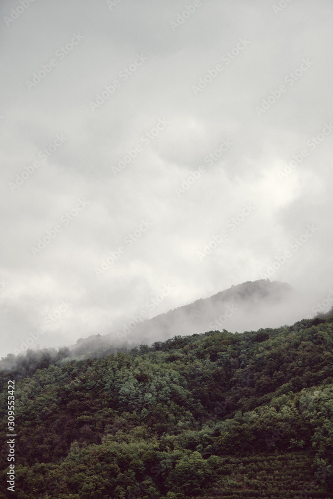 Hills hidden by fog on a cold autumn morning