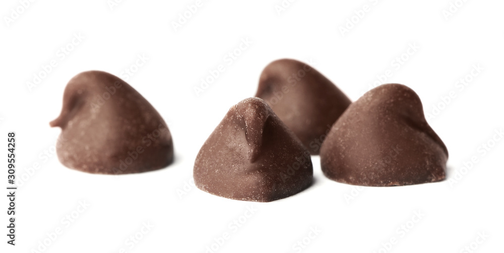 Delicious dark chocolate chips isolated on white Delicious dark chocolate chips isolated on white