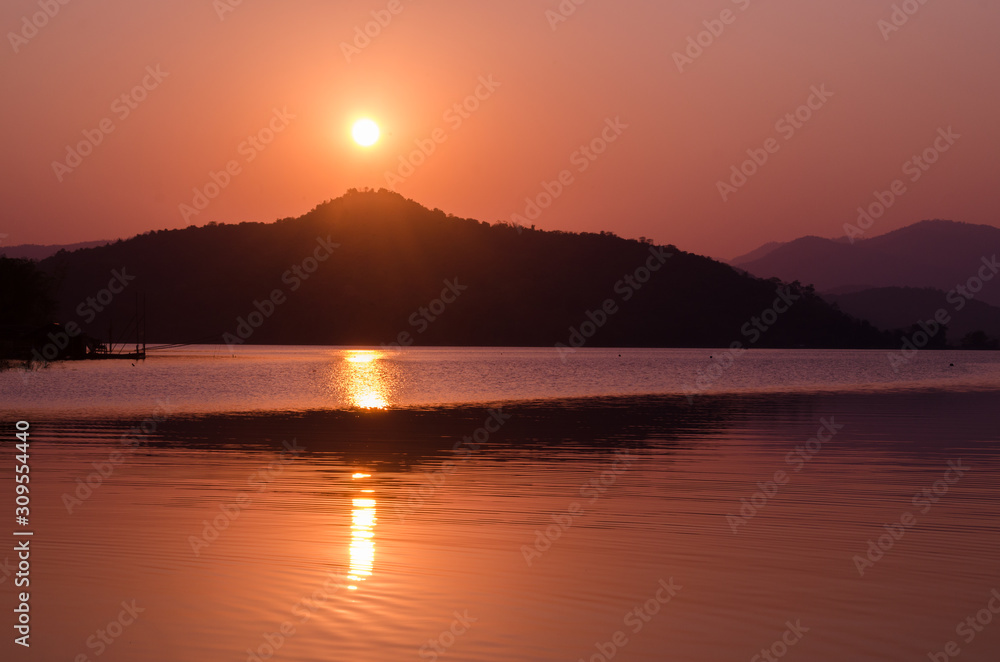 sunset sunrise over river and mountain