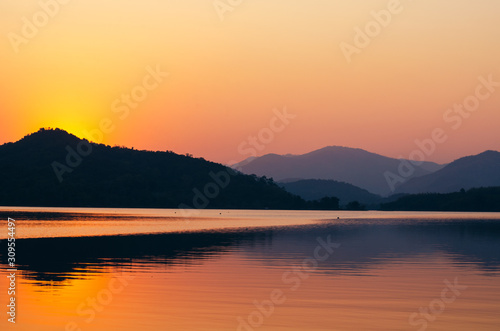 sunset sunrise over river and mountain © khlongwangchao