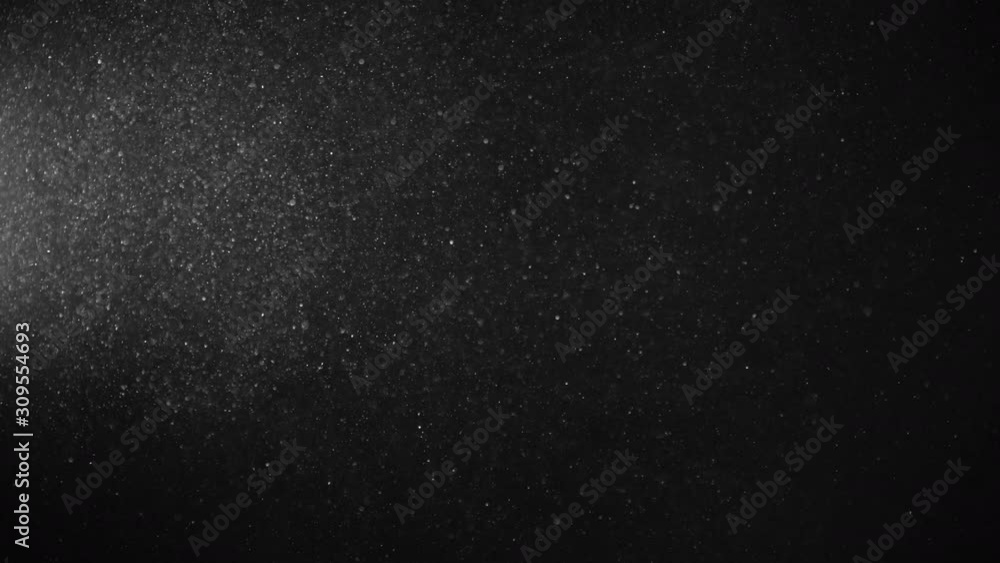 Natural Organic Dust Particles Floating On Black Background. Glittering Sparkling Particles Randomly Spin In The Air With Bokeh. Dynamic Particles With Fast And Slow Motion. Shimmering Dust In Space. Natural Organic Dust Particles Floating On Black Background. Glittering Sparkling Particles Randomly Spin In The Air With Bokeh. Dynamic Particles With Fast And Slow Motion. Shimmering Dust In Space.