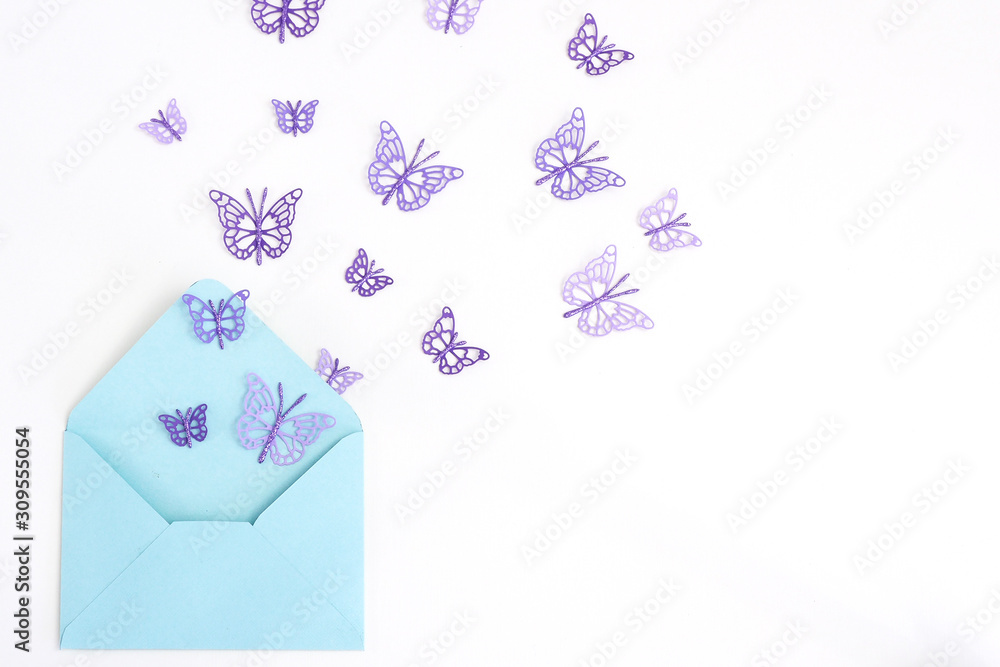 purple paper butterflies flying out of a blue paper envelope. White background... purple paper butterflies flying out of a blue paper envelope. White background...