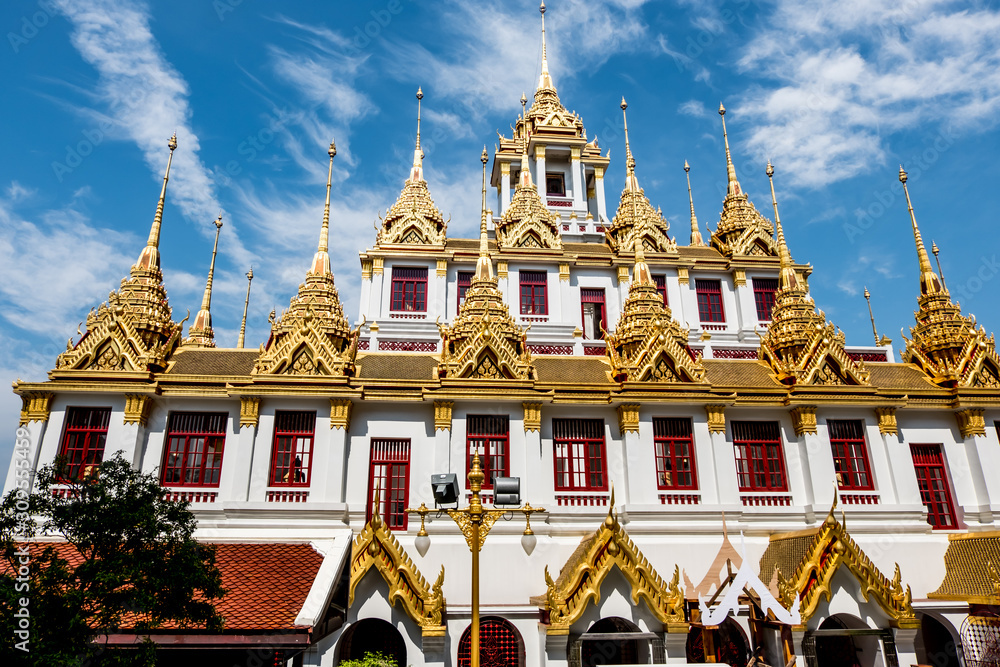 Fototapeta premium Temple roof in Bangkok Thailand. Blue sky blackgroud.