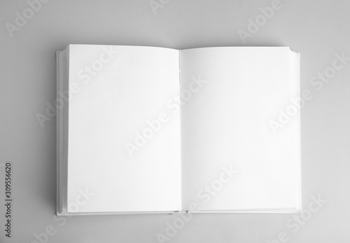 Canvas-taulu Open book with blank pages on grey background, top view
