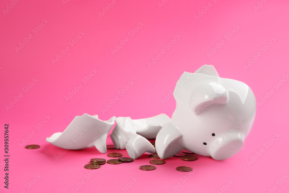 Broken piggy bank with coins on pink background Stock Photo | Adobe Stock