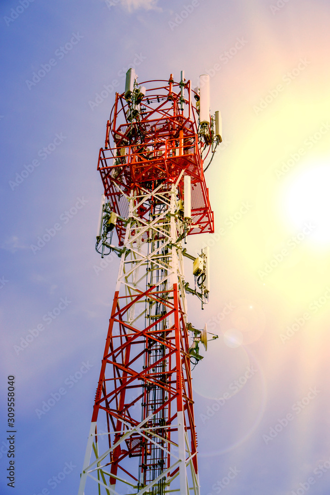 custom made wallpaper toronto digitalTelecoms tower with transmitter antenna on sun and camera lens flare background. A