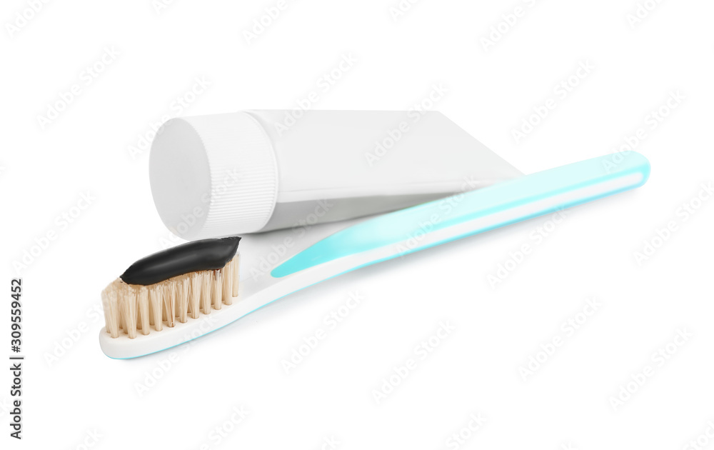 Natural bristle toothbrush with charcoal paste isolated on white Natural bristle toothbrush with charcoal paste isolated on white