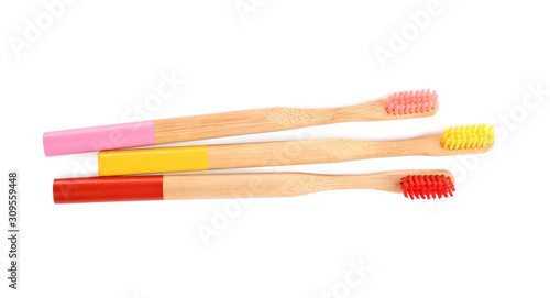 Natural toothbrushes made with bamboo isolated on white  top view