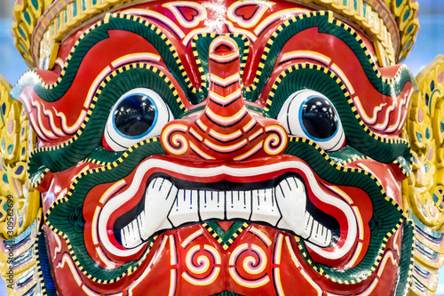 Antique Thai face giant. At Suvarnabhumi airport Thailand.