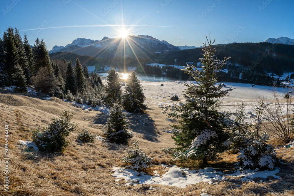 Lake geroldsee near garmisch-partenkirchen and Krün in south germany bavaria at sunrise in the winter. Relaxing morning walk with clear sky