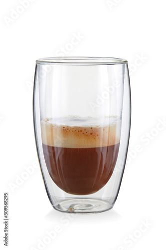 Beautiful coffee with cream and lush foam in a high transparent glass with a double contour isolated on a white background. 100 percent sharpness.