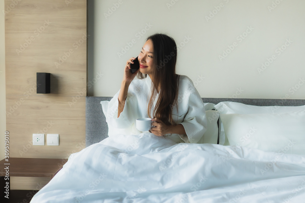Portrait beautiful young asian women happy smile with coffee and mobile phone Portrait beautiful young asian women happy smile with coffee and mobile phone