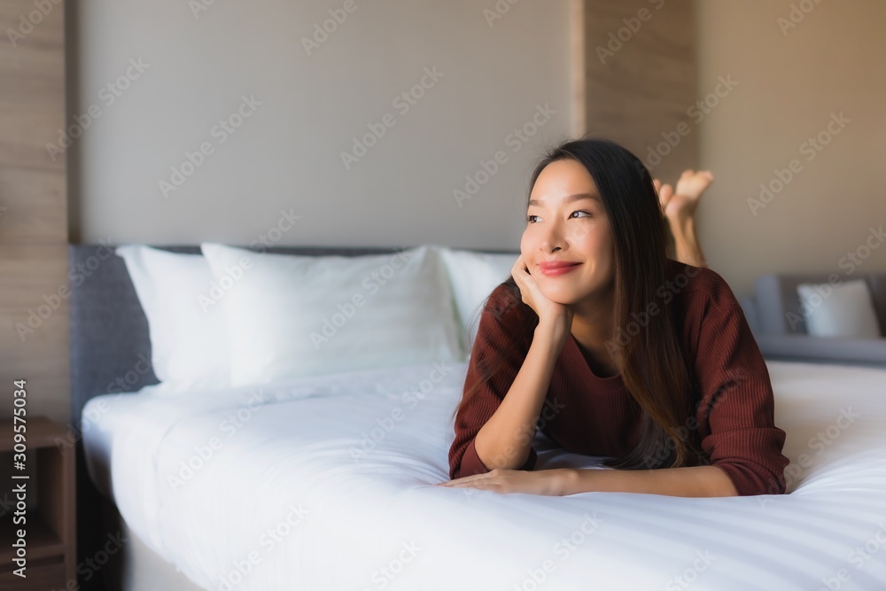 Portrait beautiful young asian women happy smile relax on bed Portrait beautiful young asian women happy smile relax on bed