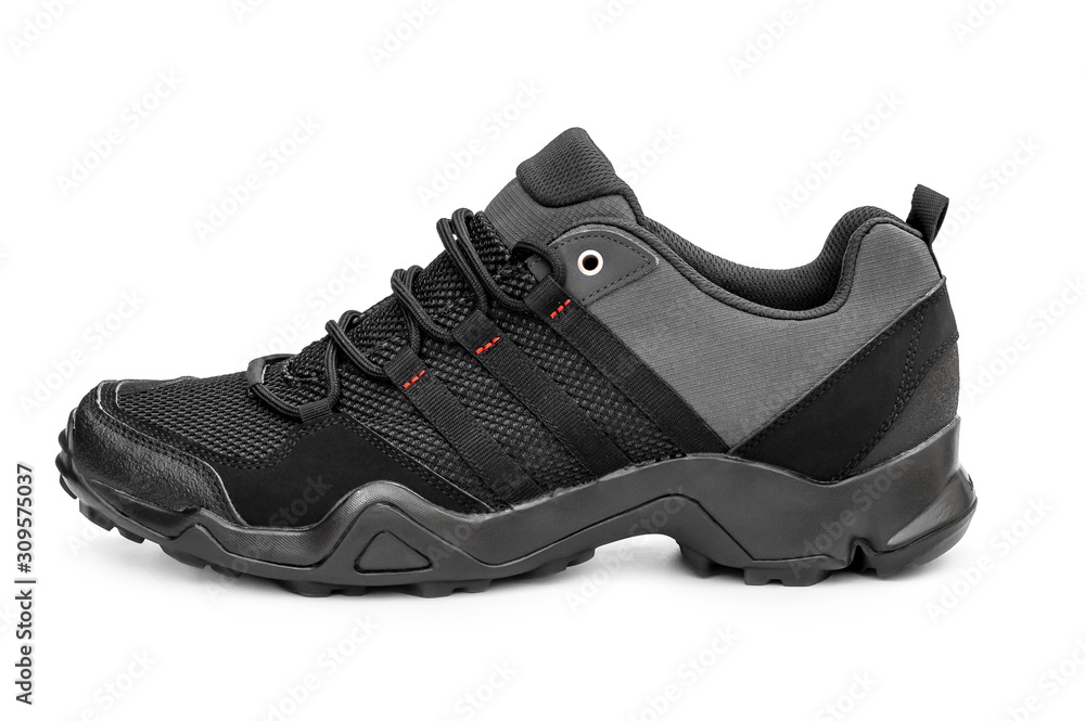 Single black sneaker on white. Single black sneaker on white.