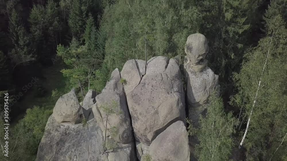 Aerial view stone rocks Ternoshorska Lada amidst beautiful scenic Carpathian mountains and forest. Symbol of motherhood and fertility, Kosiv Region, Ivano-Frankivsk Oblast, Ukraine Aerial view stone rocks Ternoshorska Lada amidst beautiful scenic Carpathian mountains and forest. Symbol of motherhood and fertility, Kosiv Region, Ivano-Frankivsk Oblast, Ukraine