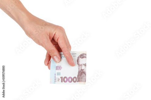 Thousand hryvnias by one banknote in the hand, isolated