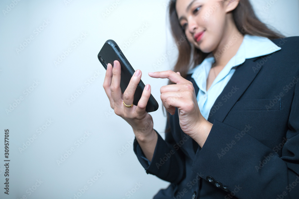 Business woman use smartphone typing a message Business woman use smartphone typing a message